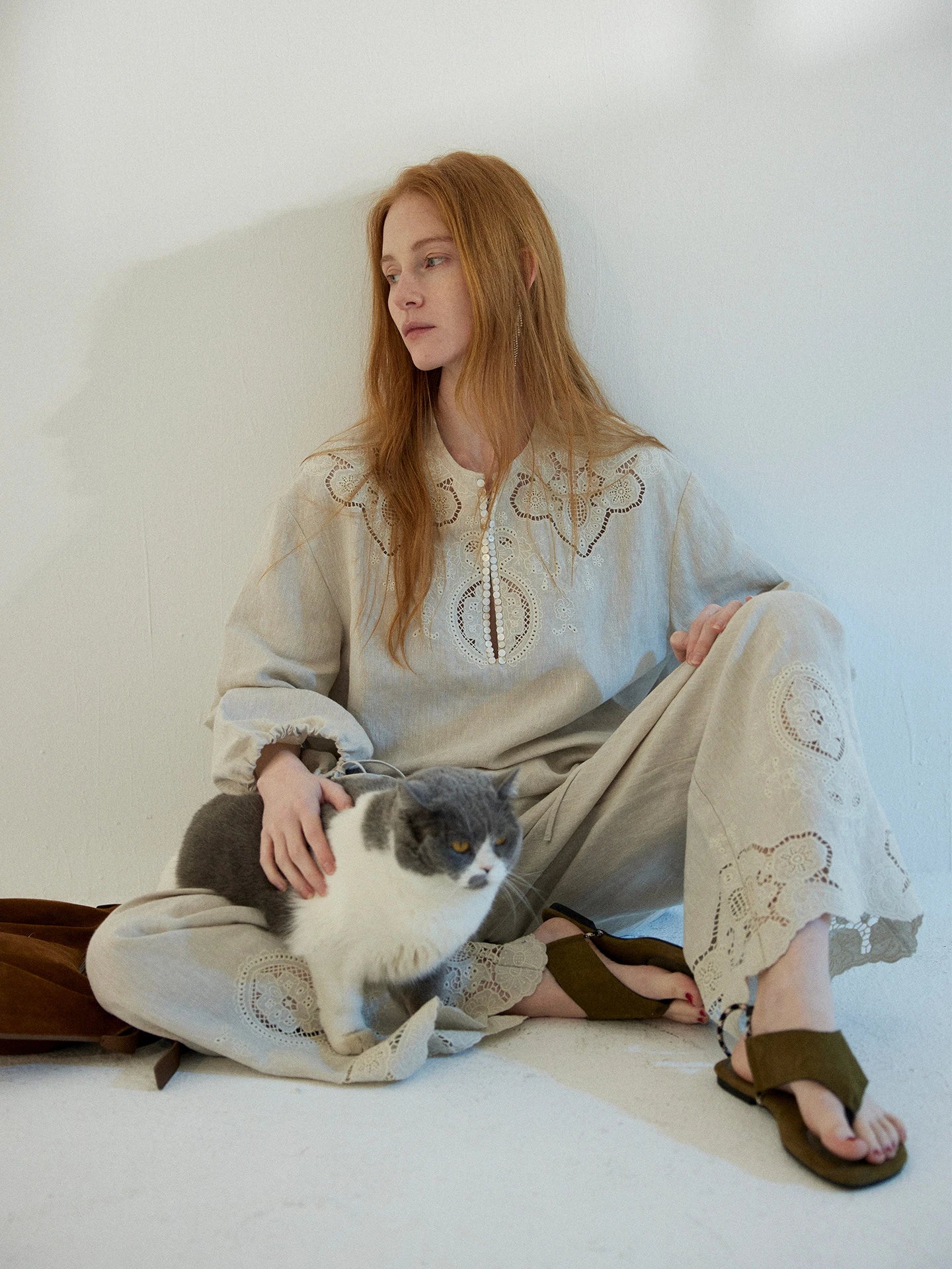 Amara embroidered linen set, seated view